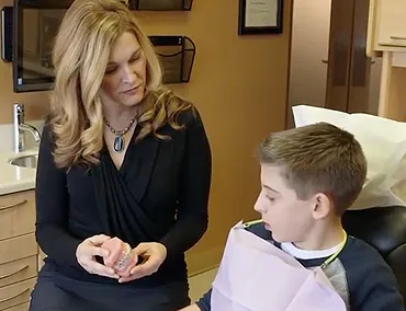 Dr. Lori Derkach with young patient